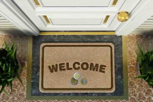 Tappeto con scritto welcome, monete