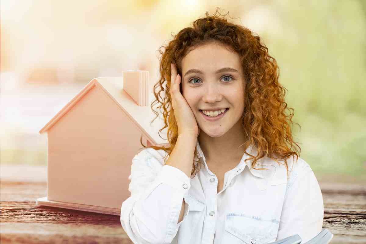 Casa in legno e persona stupita