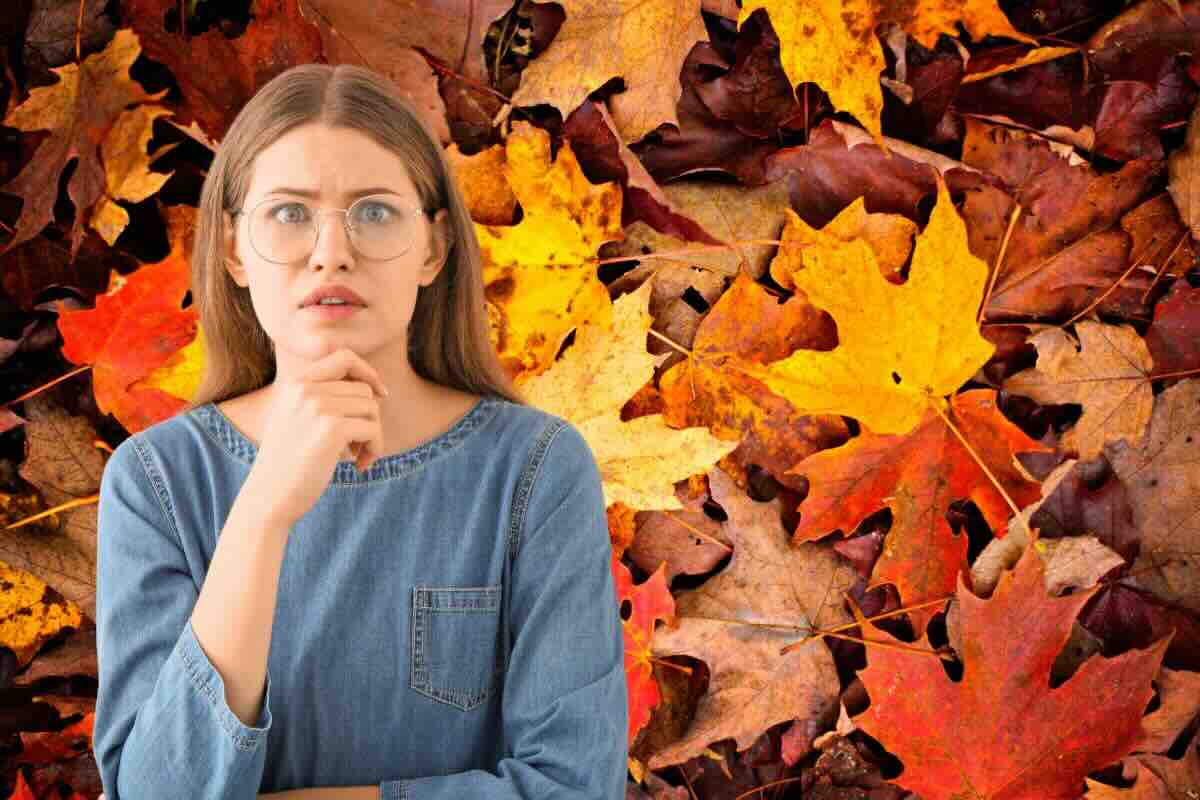 Foglie autunno, donna contrariata