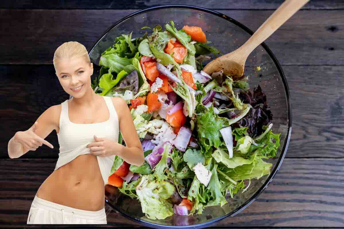 insalata e donna che indica pancia 